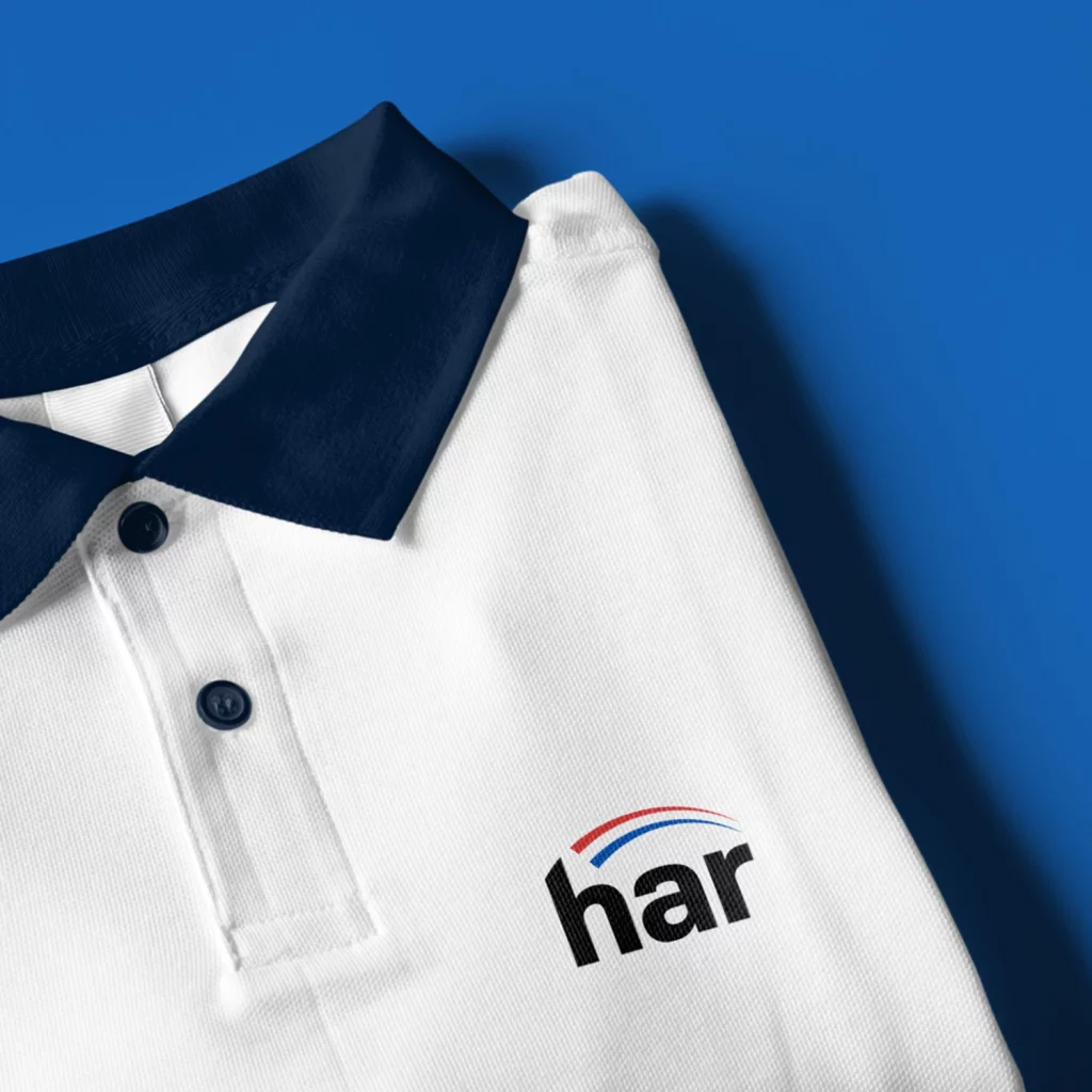HAR branding on polo shirt