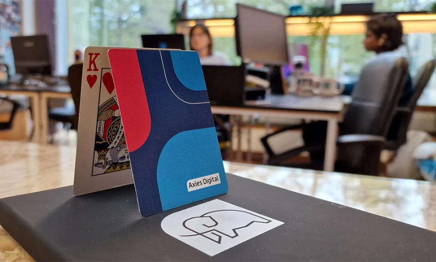 Axies Digital Marketing Agency Playing cards and branded notepad at the Leicester Office. Digital Marketing Office specialising in Google Ads, SEO, PPC, Meta Ads